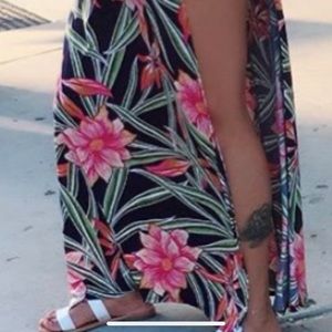 A flower romper split maxi dress. Only worn once.
